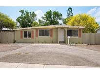 Charming single-story home with a cozy front yard and a well-maintained exterior paint at 1858 Oregon Ave Ne, St Petersburg, FL 33703