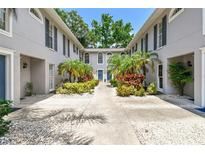 Charming courtyard view of a beautifully landscaped home exterior at 3205 W De Leon St # F, Tampa, FL 33609