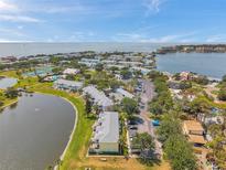 Stunning aerial view of the community featuring lush landscaping, waterfront access, and ample parking at 4734 Cobia Se Dr # A, St Petersburg, FL 33705