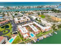 Gorgeous waterfront community with a pool, boat slips, parking, and views of the bay and ocean at 8931 Blind Pass Rd # 262, St Pete Beach, FL 33706