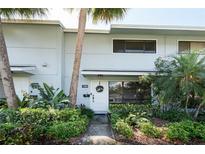 Charming townhome featuring lush landscaping and a welcoming front entrance, close to all community ammenities at 108 Biscayne Ave # B, Tampa, FL 33606