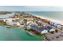 Beautiful waterfront townhomes with docks, showcasing stunning views of the bay and beach at 9939 1St E St, Treasure Island, FL 33706