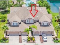 Inviting townhome with attached garages and lush landscaping in a desirable community near a pool at 10329 Willow Leaf Trl, Tampa, FL 33625