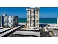 Coastal condominium featuring beach access, covered parking, and partial water views at 17408 Gulf Blvd # 203, Redington Shores, FL 33708