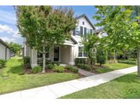 Charming two-story home with beautifully landscaped front yard and inviting entrance at 3757 Villamore Ln, Odessa, FL 33556