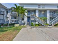 Attractive condo building with well-maintained landscaping and convenient parking at 4801 W Mcelroy Ave # D104, Tampa, FL 33611
