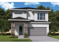Modern two-story home featuring stone accents, gray siding, and an attached two-car garage at 648 Allora Ave, Nokomis, FL 34275