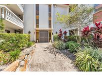 Welcoming entrance with a well-maintained landscape and a secure, double-door entryway at 1001 Pearce Dr # 106, Clearwater, FL 33764