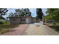 Charming single-story home featuring a well-maintained front yard and inviting entryway at 10118 114Th Ter, Largo, FL 33773