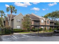 Charming multi-Gathering condo with tropical landscaping, screened in porches and covered parking at 2500 Winding Creek Blvd # A104, Clearwater, FL 33761