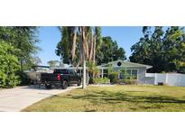 Charming single-story home features a well-manicured lawn and a convenient driveway with ample parking at 310 4Th Sw Ave, Ruskin, FL 33570