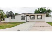 Charming single-story home featuring a well-maintained lawn and inviting covered entry at 4902 Murray Hill Drive, Tampa, FL 33615