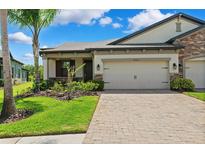 Charming one-story home with manicured landscaping and a two-car garage at 19323 Hawk Valley Dr, Tampa, FL 33647