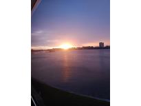 Beautiful sunset view over the water with a city skyline in the background at 1898 Shore S Dr # 311, South Pasadena, FL 33707