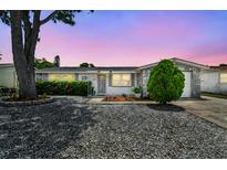 Charming single-story home with stone accents and a well-maintained front yard at 1150 Grand Blvd, Holiday, FL 34690