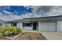 Charming single-story home featuring a one-car garage and well-maintained front yard at 6212 Emerson Dr, New Port Richey, FL 34653