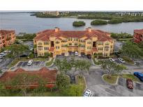 Beautiful multi-Gathering condo building with tile roof and waterfront views at 2739 Via Capri # 1011, Clearwater, FL 33764
