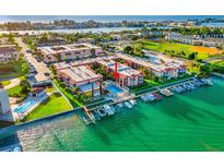 Waterfront condo complex with a community pool and boat docks along the pristine Intracoastal waterway at 8921 Blind Pass Rd # 142, St Pete Beach, FL 33706