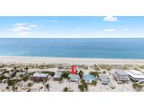 Charming beach house nestled on the pristine white sands with ocean views at 9760 Little Gasparilla Island, Placida, FL 33946