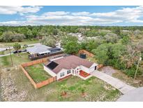 Charming single-story home with a fenced backyard and a well-maintained lawn in a serene neighborhood at 12279 Elmore Dr, Spring Hill, FL 34609