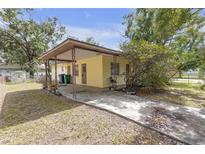 Charming single-story home with covered parking and a welcoming entrance at 2724 W Henry Ave, Tampa, FL 33614