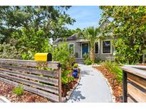 Charming home showcasing a beautifully landscaped front yard and inviting walkway to the entrance at 2859 Dartmouth N Ave, St Petersburg, FL 33713