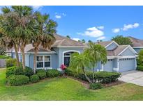 Charming single story home with lush landscaping, mature palms and a three car garage at 10502 Brentford Dr, Tampa, FL 33626