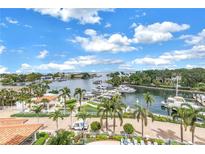 Beautiful waterfront views with boats docked and palm trees, perfect for a relaxing lifestyle at 1325 Snell Isle Ne Blvd # 505, St Petersburg, FL 33704