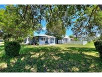 Charming single-story home with well-maintained lawn and mature trees offering curb appeal at 3763 Darthmouth N Ave, St Petersburg, FL 33713