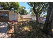 Charming single-story home with brick accents and a spacious front yard at 4607 N 35Th St, Tampa, FL 33610