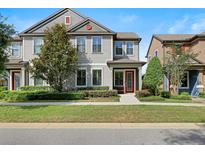 Charming two-story home with well-manicured lawn and vibrant landscaping at 5613 Kingsley Corner Way, Lithia, FL 33547