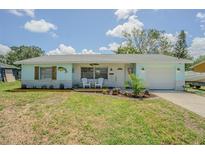 Charming single-story home with a manicured lawn and lovely curb appeal at 402 12Th Sw St, Ruskin, FL 33570