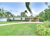 Charming single-story home featuring a well-maintained lawn and neatly trimmed hedges at 4291 Neptune Se Dr, St Petersburg, FL 33705