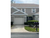 Charming townhome with a one car garage and a well manicured lawn and mature landscaping at 7838 66Th N Way, Pinellas Park, FL 33781
