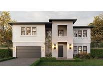 Stunning two-story home with brick and white siding, complemented by professional landscaping and an attached garage at 811 W Ohio Ave, Tampa, FL 33603