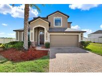 Stunning two-story home featuring a two-car garage and beautiful landscaping at 10106 Count Fleet Dr, Ruskin, FL 33575