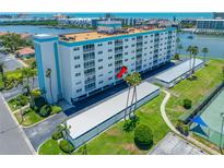 Enjoy waterfront views from this desirable condo building complete with covered parking and lush landscaping at 10216 Regal Dr # 208, Largo, FL 33774