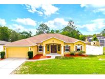 Beautiful single-Gathering home boasts a well-maintained lawn, attractive landscaping, and inviting curb appeal at 13216 Antelope St, Spring Hill, FL 34609