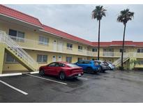 Well-maintained apartment complex with manicured landscaping, ample parking, and multiple units at 4103 Gulf Blvd # 104, St Pete Beach, FL 33706