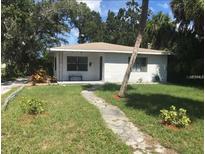 Charming single-story home with a traditional brick facade and a well-maintained front lawn at 4819 21St S Ave, St Petersburg, FL 33711