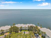 Stunning aerial view of waterfront condos with easy beach access and beautiful water views at 5260 Coquina Key Se Dr # C, St Petersburg, FL 33705