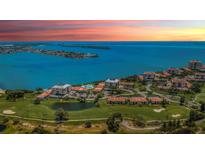 Beautiful community overlooking the water, golf course, and colorful sunset at 6158 Palma Del Mar S Blvd # 306, St Petersburg, FL 33715