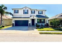 Charming two-story home with a well-maintained lawn, two car garage and a beautiful entrance at 1147 Halapa Way, Trinity, FL 34655