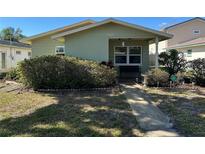 Charming home featuring a well-maintained front yard with lush greenery and welcoming walkway at 3827 15Th N Ave, St Petersburg, FL 33713