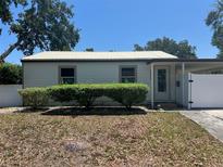 Charming single story home with a metal roof and a well-maintained lawn at 4899 7Th N St, St Petersburg, FL 33703