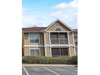 Inviting condo showcasing a charming balcony with a beige exterior paint scheme at 9481 Highland Oak Dr # 814, Tampa, FL 33647