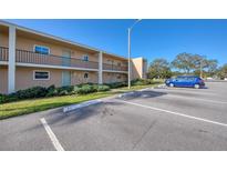 Exterior view of the two-story building with parking, reserved space available at 12300 Park Blvd # 222, Seminole, FL 33772