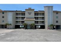Three story condo building offering covered parking, balconies, and convenient beach access at 16330 Gulf Blvd # 201, Redington Beach, FL 33708