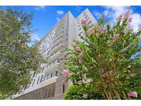 Beautiful, modern high-rise condo building with balconies and vibrant landscaping at 199 Dali Blvd # 2, St Petersburg, FL 33701
