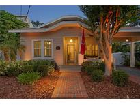 Charming home with a brick walkway, inviting porch, and manicured landscaping at 3620 W San Pedro St, Tampa, FL 33629